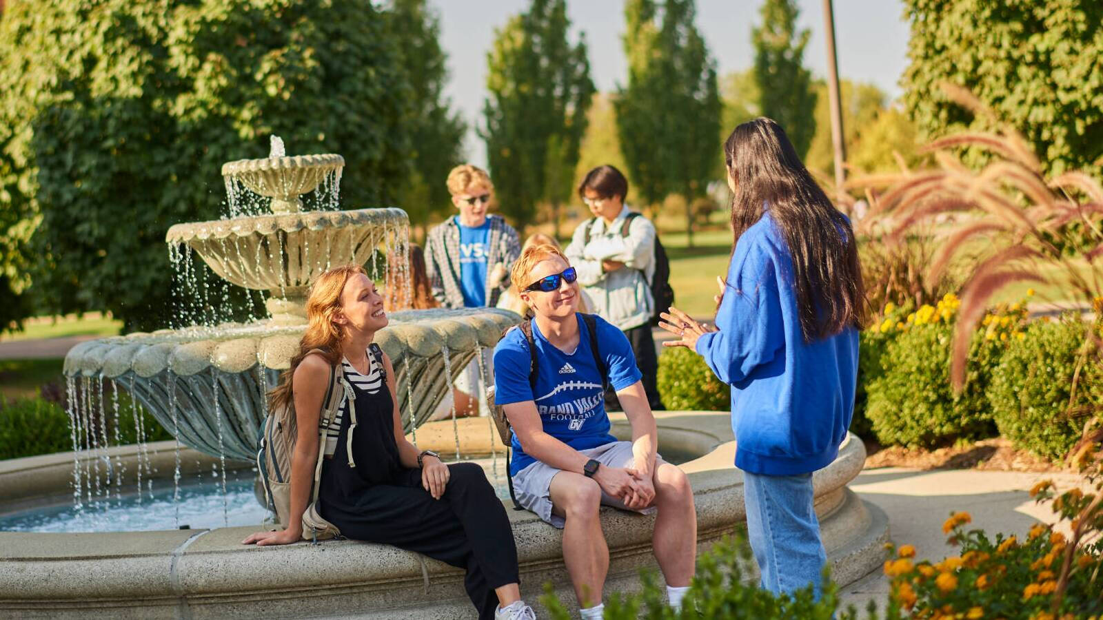 Students around a fountain on the valley campus